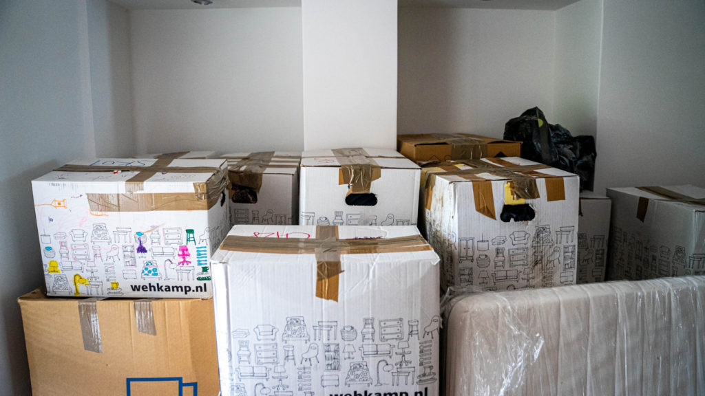Cardboard boxes stored in the room.